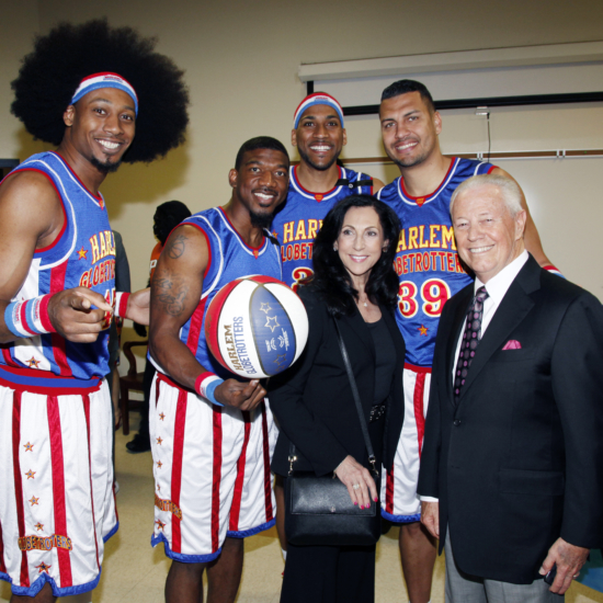 Cynthia & Dr. Savelle w Globetrotters